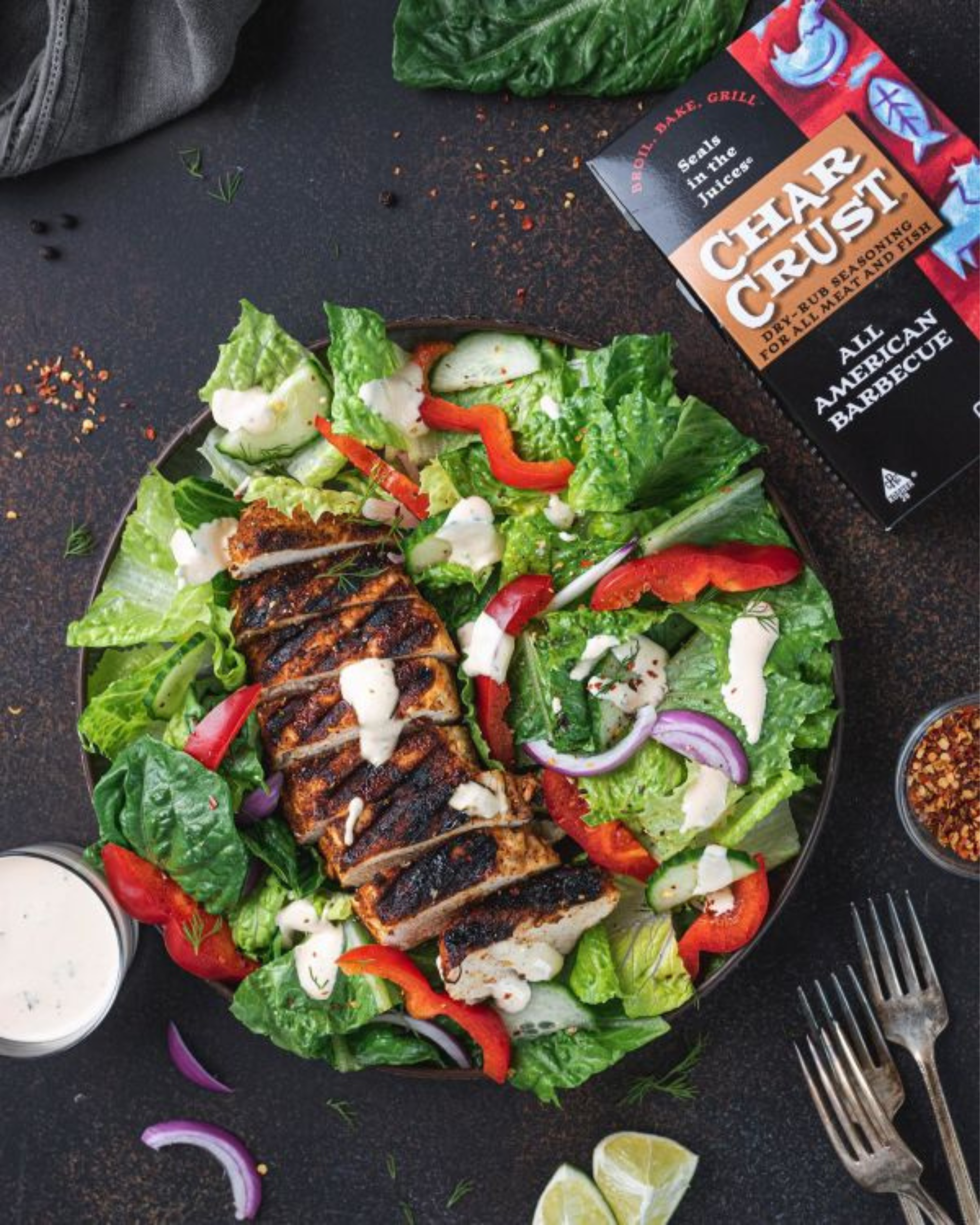 Char Crust® All American Barbecue on chicken placed in a salad. Char Crust is used as a chicken rub in this picture.