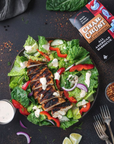 Char Crust® All American Barbecue on chicken placed in a salad. Char Crust is used as a chicken rub in this picture.